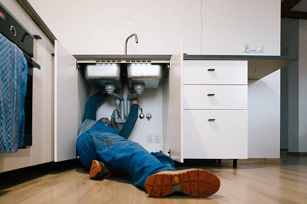 Professional Drain Cleaning technician working in Springfield, MI